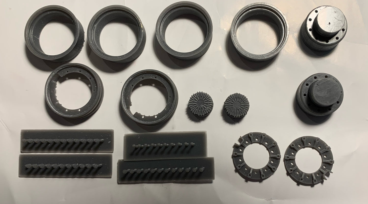 1 pair of 1/24 Sisu heavy duty reduction hubs and rims.